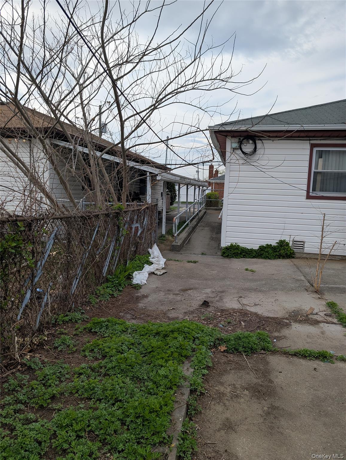 143-47 228th Street Queens, NY 11413 - Photo 11 of 18 a view of a house with a yard