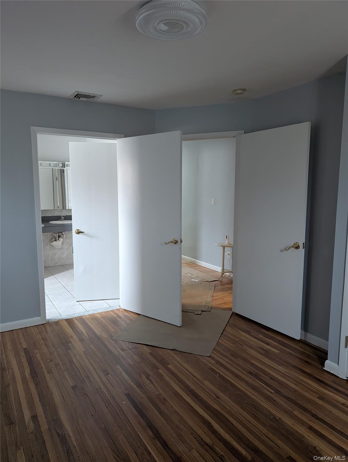 143-47 228th Street Queens, NY 11413 - Photo 13 of 18 a view of empty room with wooden floor