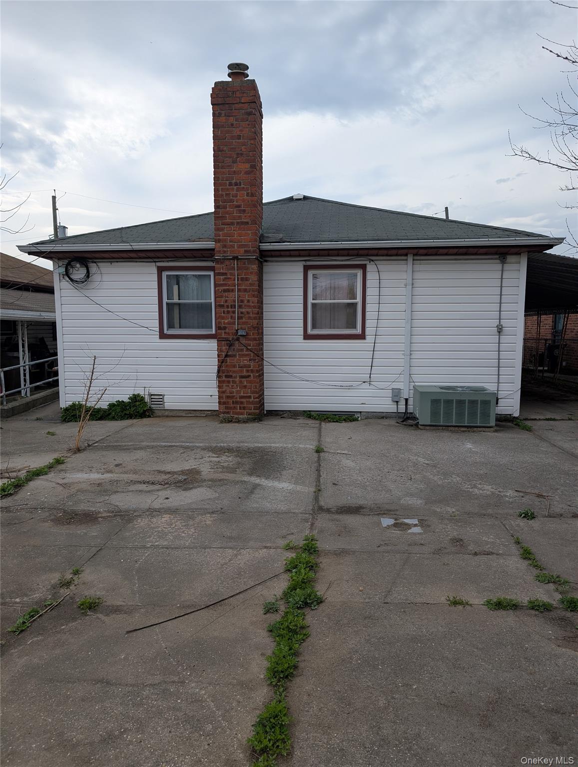143-47 228th Street Queens, NY 11413 - Photo 2 of 18 a front view of a house with a yard