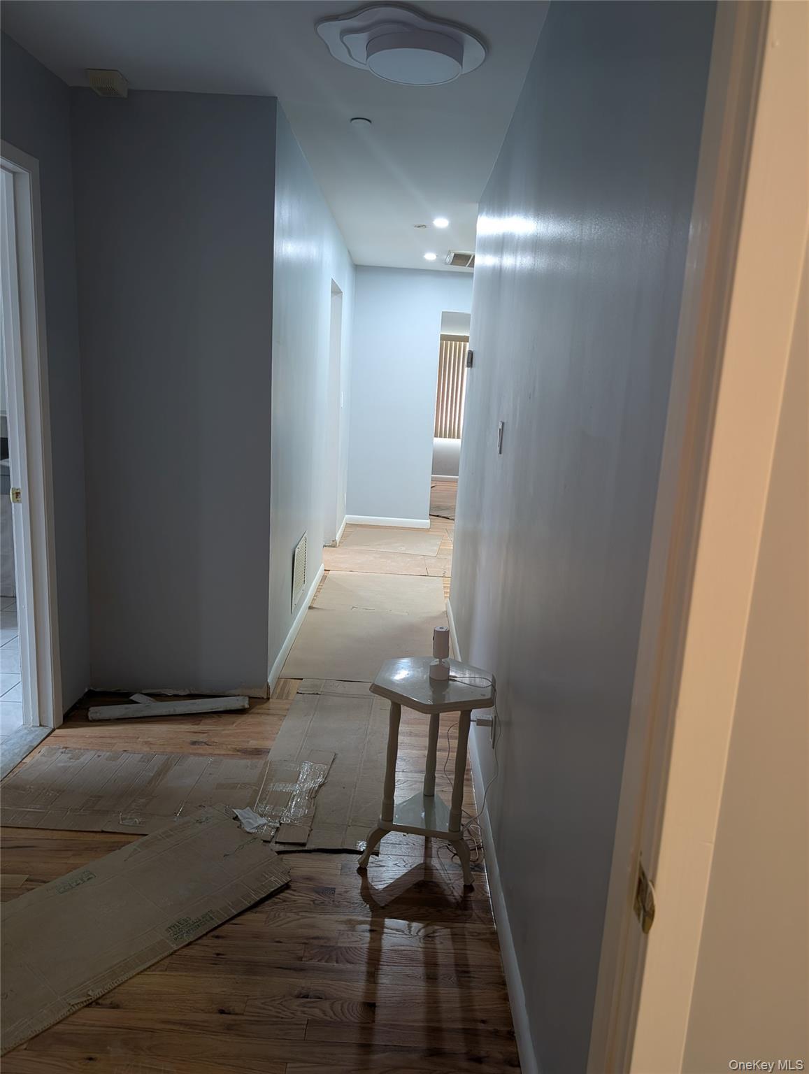 143-47 228th Street Queens, NY 11413 - Photo 4 of 18 a view of entryway and hall with wooden floor