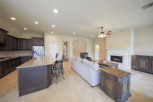 a living room with furniture wooden floor and a fireplace