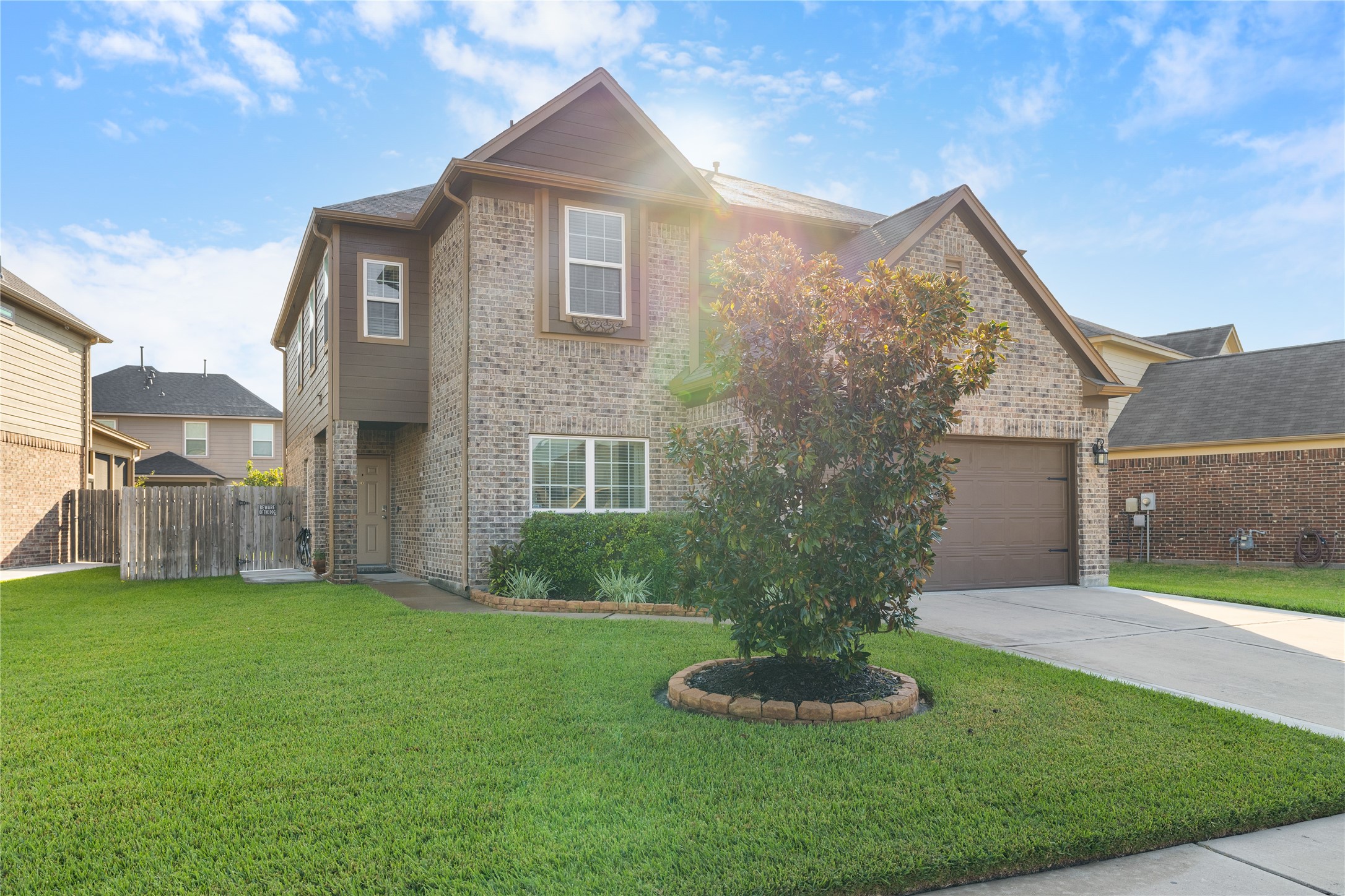 14906 Rustler Gate Lane Cypress, TX 77433 - Photo 2 of 30 a front view of a house with a yard and garage