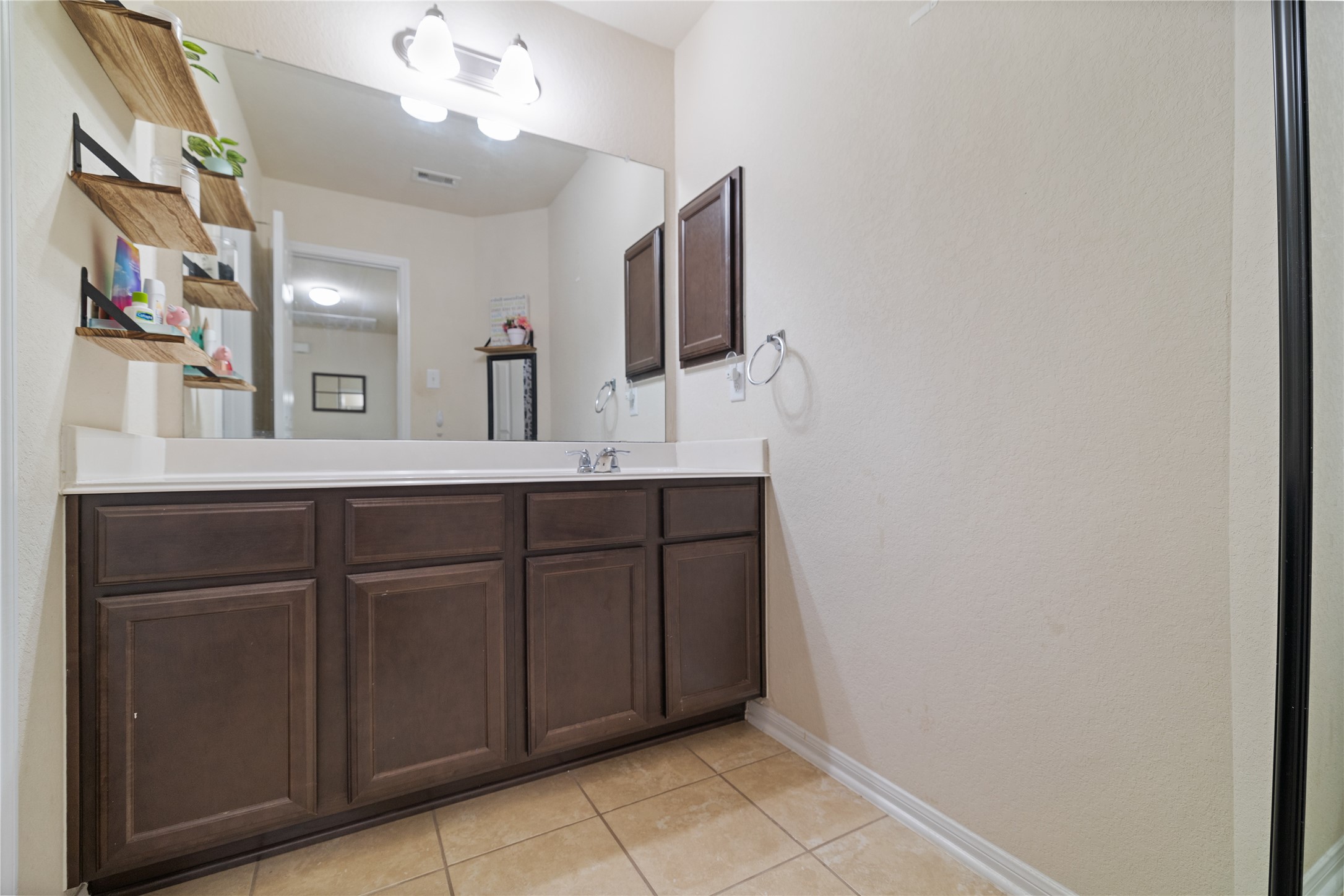 14906 Rustler Gate Lane Cypress, TX 77433 - Photo 24 of 30 a bathroom with a sink and a mirror