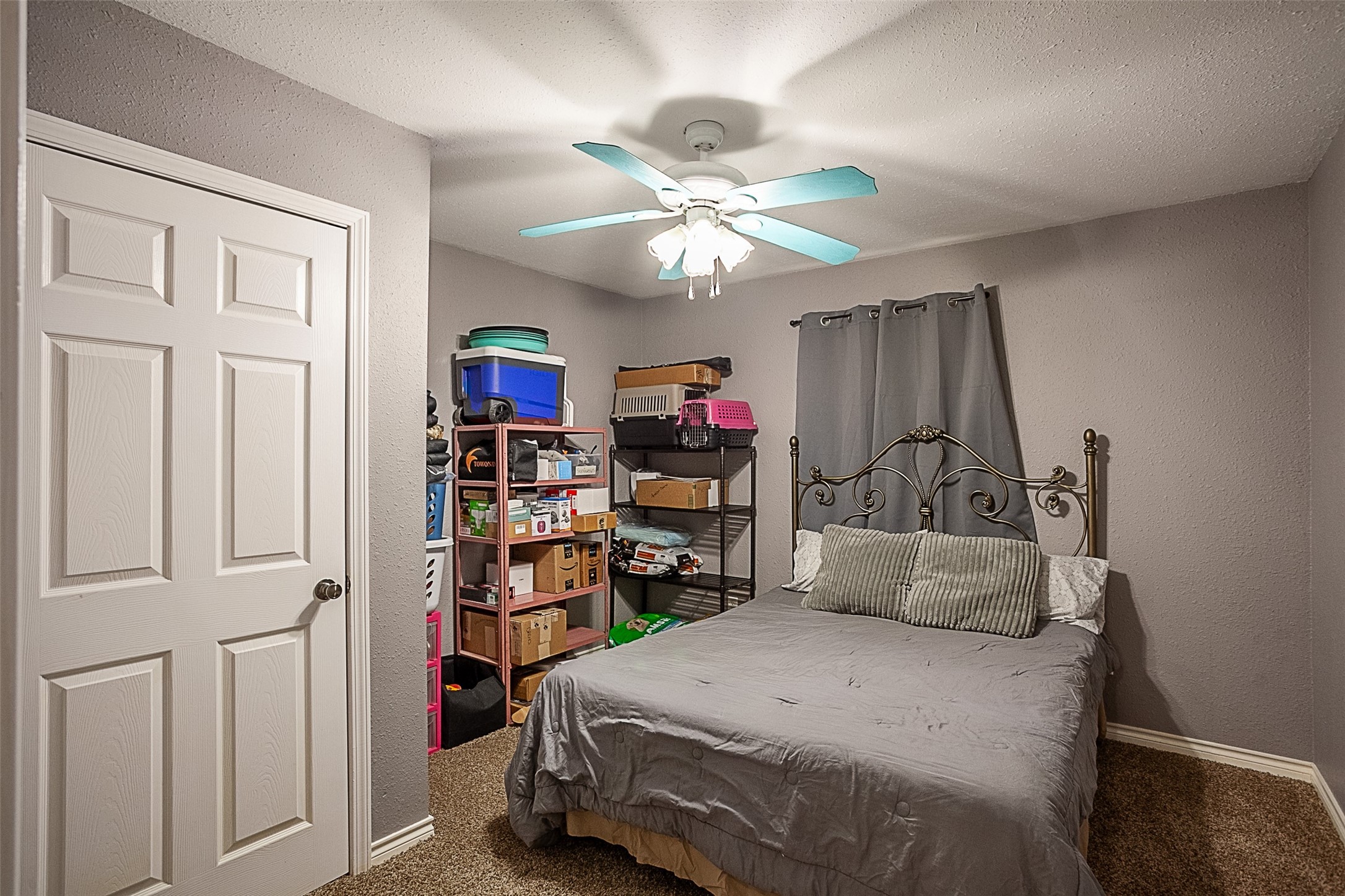 2704 62nd Street Port Arthur, TX 77640 - Photo 15 of 30 a bedroom with bed and a chandelier
