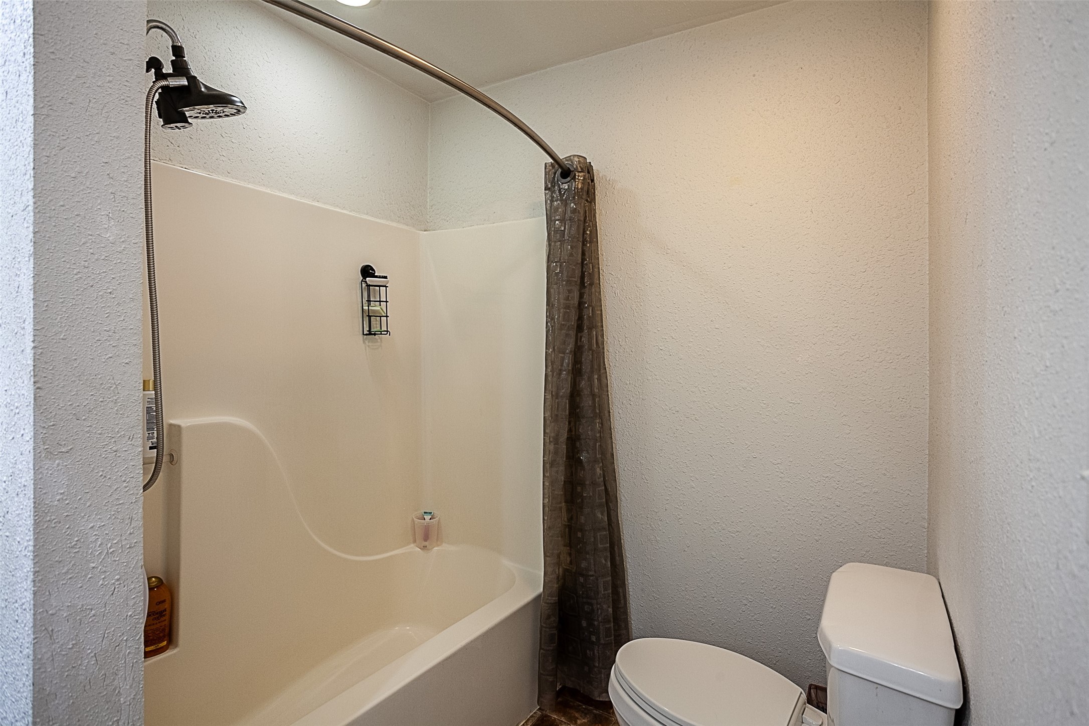 2704 62nd Street Port Arthur, TX 77640 - Photo 17 of 30 a bathroom with a toilet and a bathtub