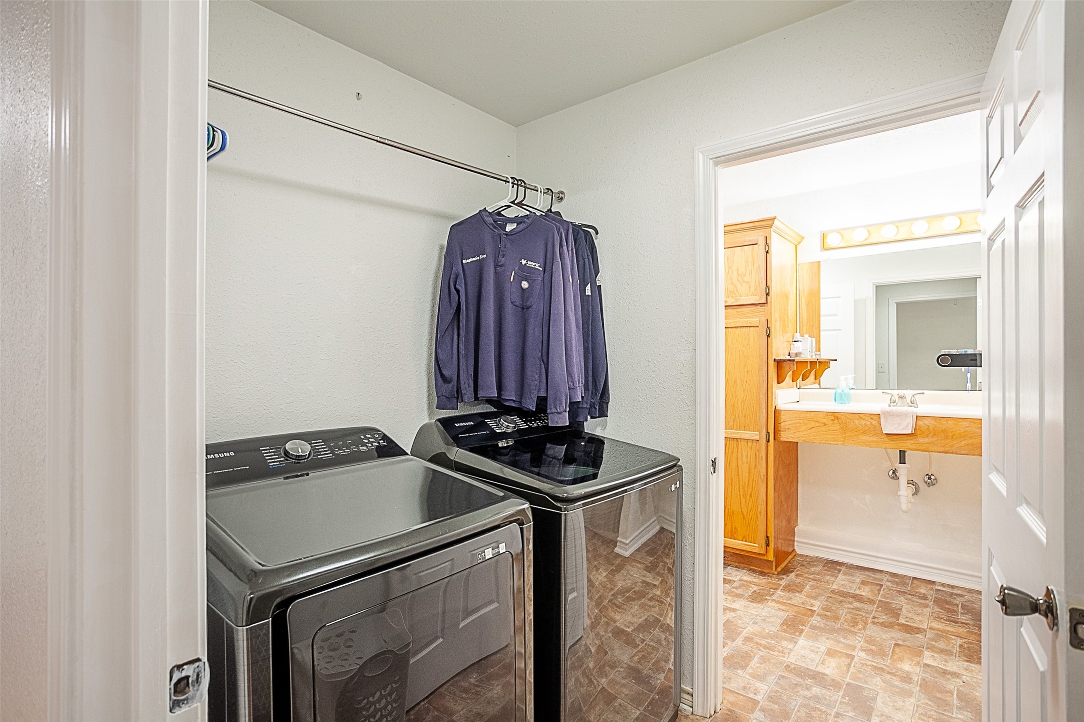 2704 62nd Street Port Arthur, TX 77640 - Photo 19 of 30 a utility room with a sink dryer and washer