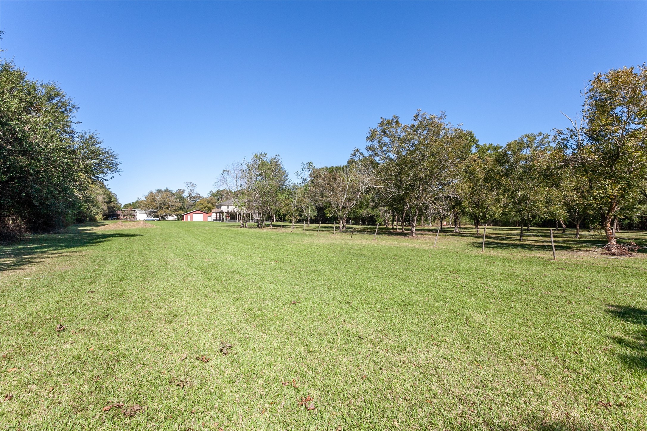 2704 62nd Street Port Arthur, TX 77640 - Photo 26 of 30 a view of a green field with wooden fence