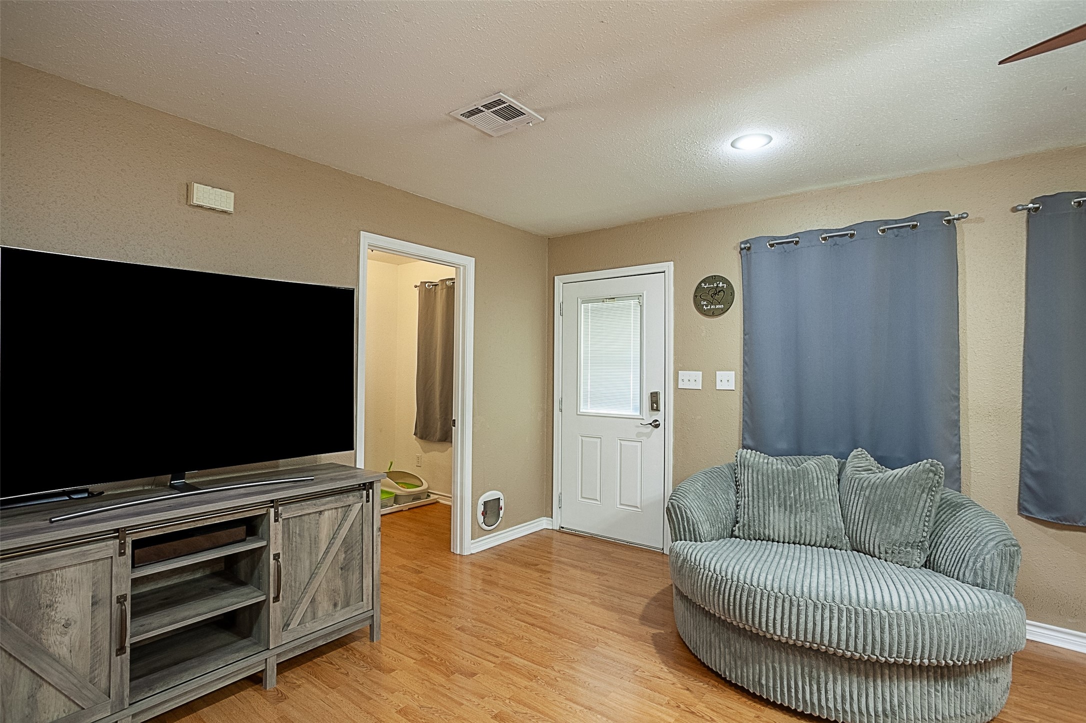 2704 62nd Street Port Arthur, TX 77640 - Photo 3 of 30 a living room with furniture and a flat screen tv