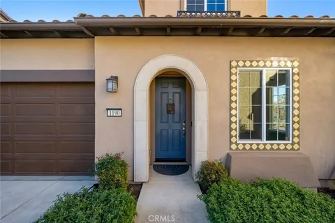 a kitchen with a sink a counter space wooden floor and appliances