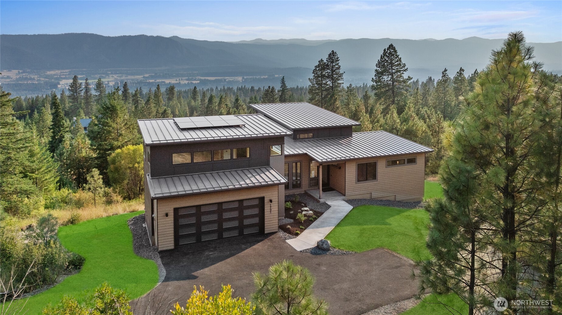 1721 Forest Ridge Drive Cle Elum, WA 98922 - Photo 4 of 33 a view of a house with a yard and a garden