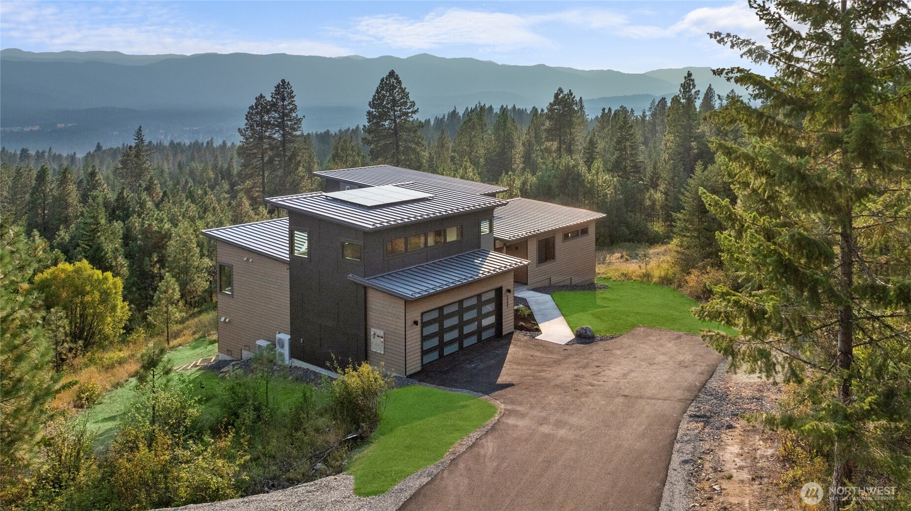 1721 Forest Ridge Drive Cle Elum, WA 98922 - Photo 5 of 33 a view of a house with a yard and a trees