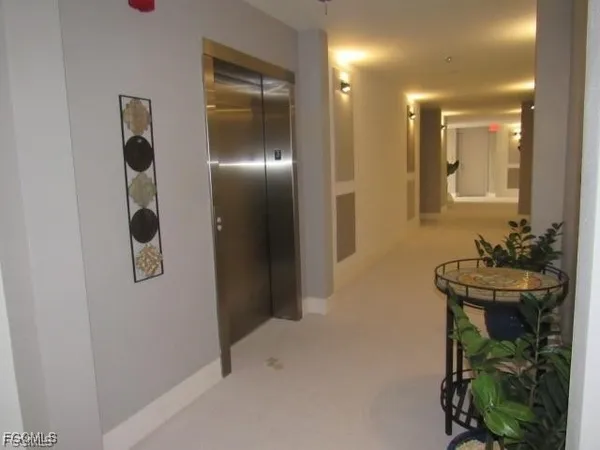 a table with a potted plant and a window