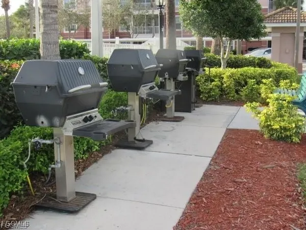 a utility room with cabinets washer and dryer