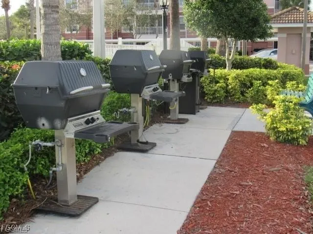 a utility room with cabinets washer and dryer