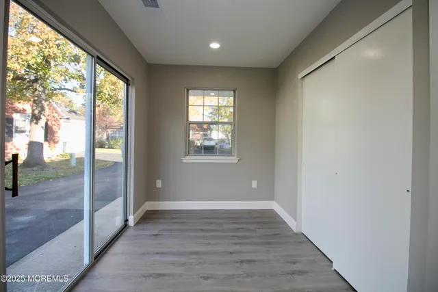 a view of entryway with wooden floor
