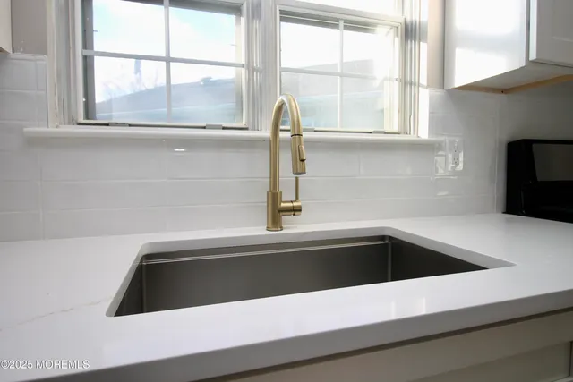 a kitchen with a sink and a window
