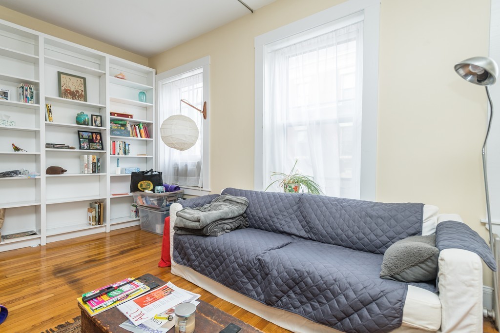 20 Grove Street Boston, MA 02114 - Photo 11 of 29 a living room with furniture and a wooden floor