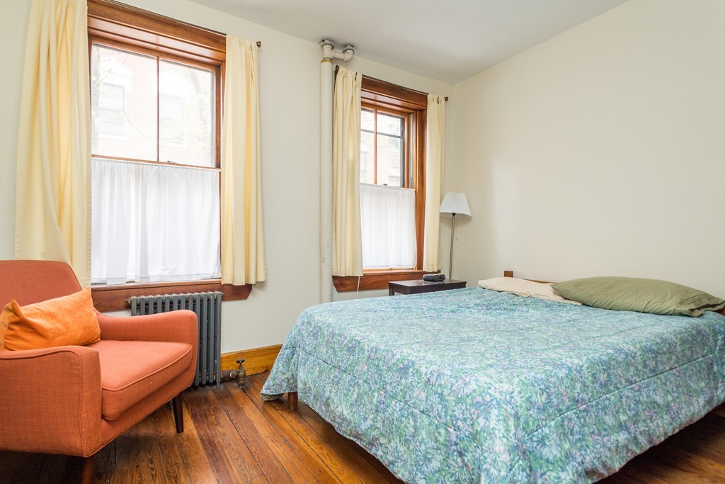 20 Grove Street Boston, MA 02114 - Photo 21 of 29 a bedroom with a bed and a couch