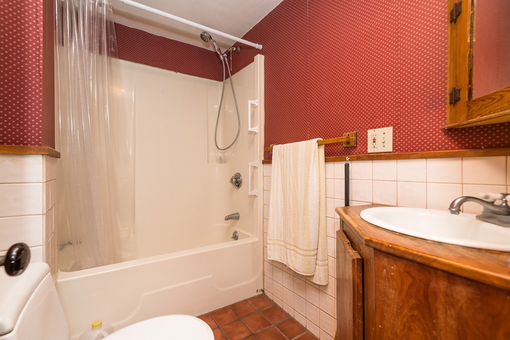 20 Grove Street Boston, MA 02114 - Photo 22 of 29 a bathroom with a sink a toilet and shower