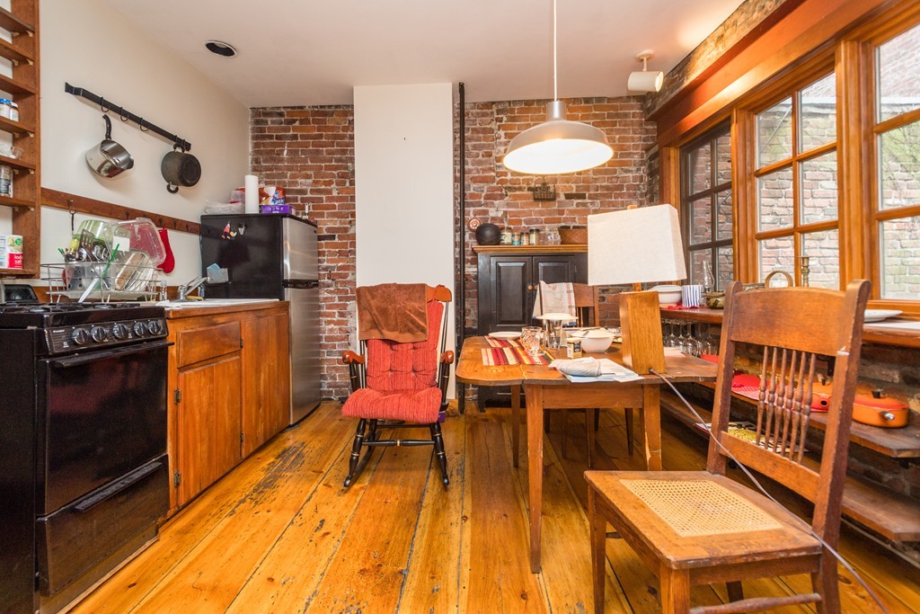 20 Grove Street Boston, MA 02114 - Photo 23 of 29 a view of a kitchen with furniture and a kitchen