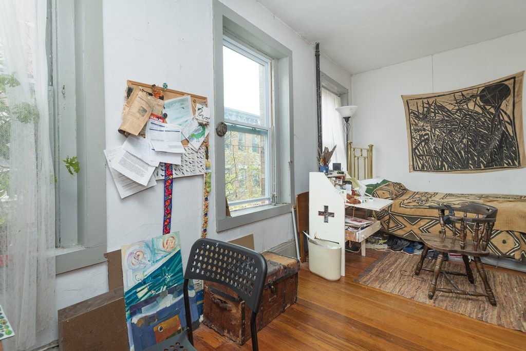 20 Grove Street Boston, MA 02114 - Photo 26 of 29 a dining room with furniture and wooden floor