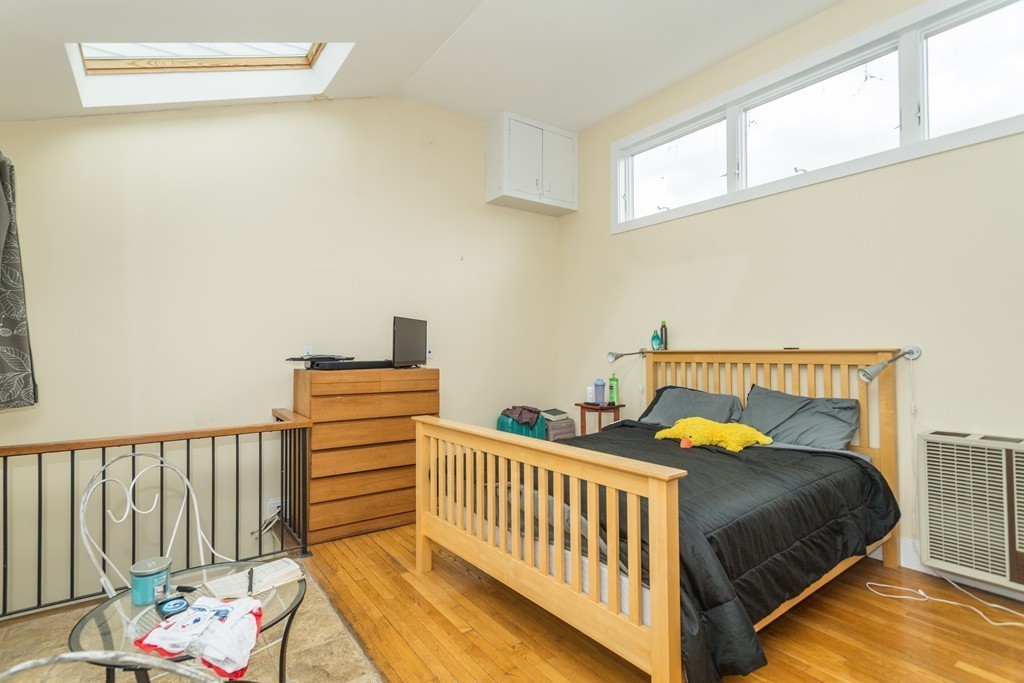 20 Grove Street Boston, MA 02114 - Photo 5 of 29 a bedroom with two beds and a window