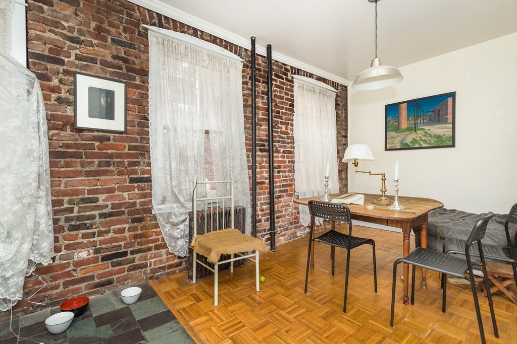20 Grove Street Boston, MA 02114 - Photo 8 of 29 a view of a dining room with furniture and wooden floor
