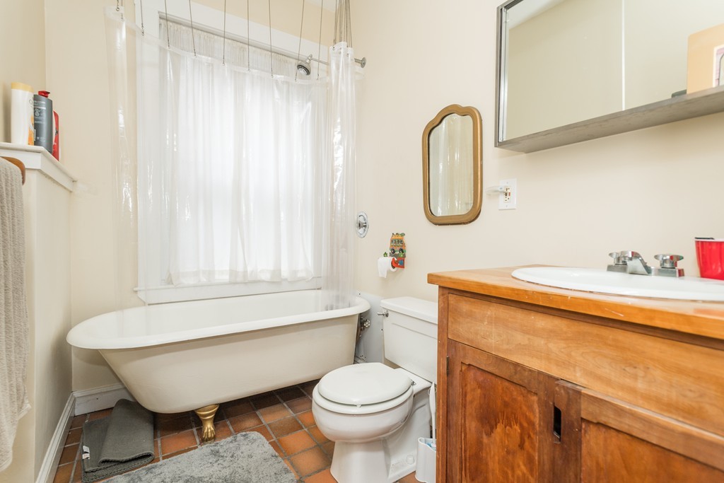 20 Grove Street Boston, MA 02114 - Photo 9 of 29 a bathroom with a toilet a sink and bathtub