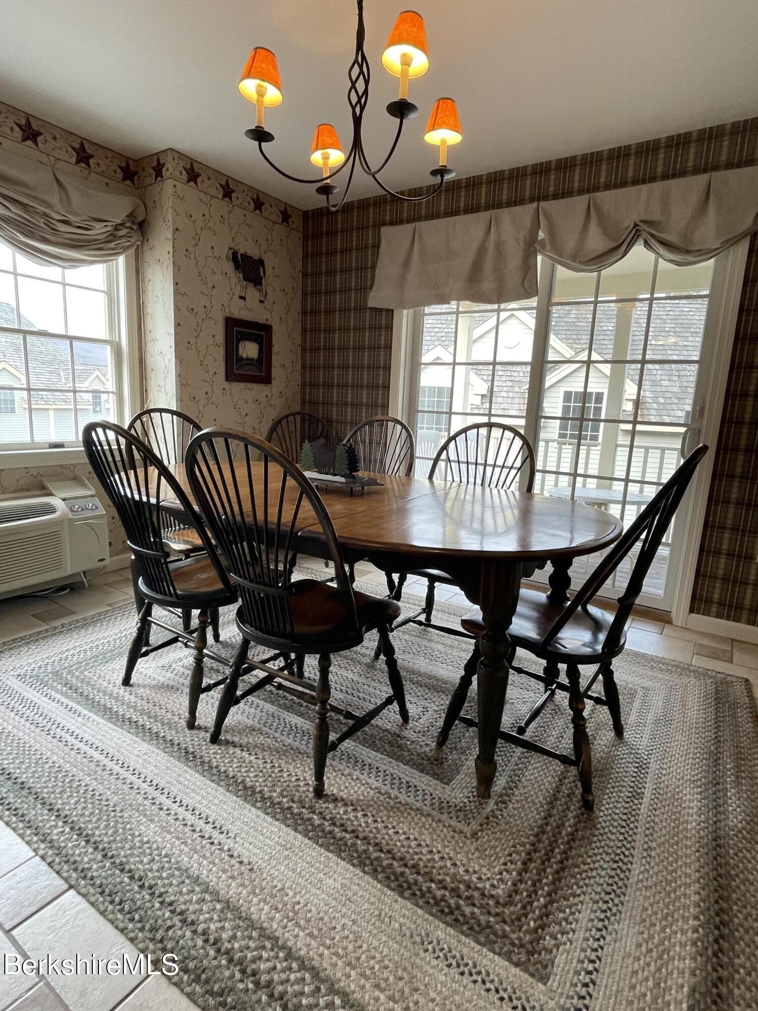 37 Corey Road, Unit 822 Hancock, MA 01237 - Photo 12 of 25 a view of a dining room with furniture and window