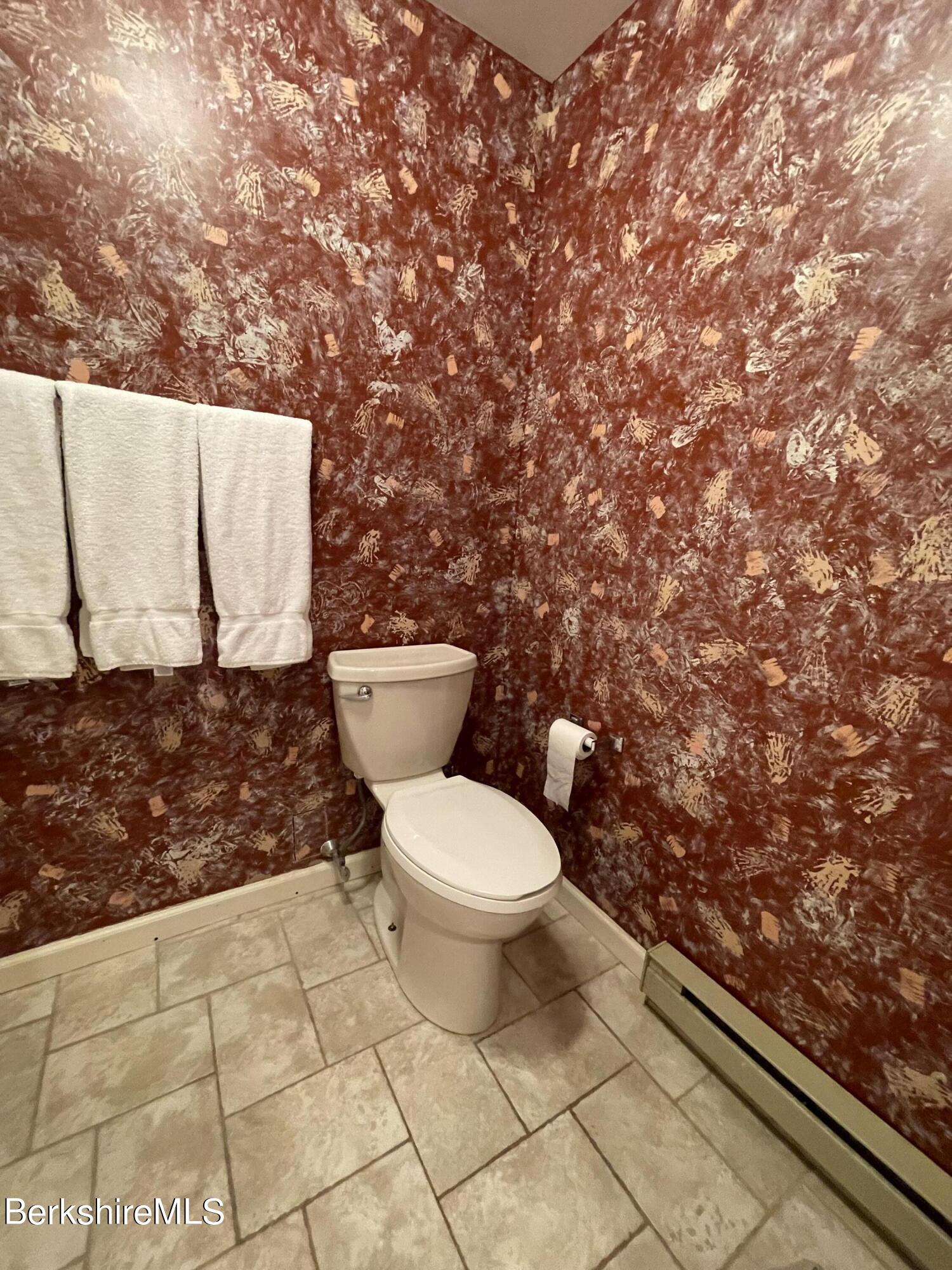 37 Corey Road, Unit 822 Hancock, MA 01237 - Photo 23 of 25 a white toilet sitting next to a shower