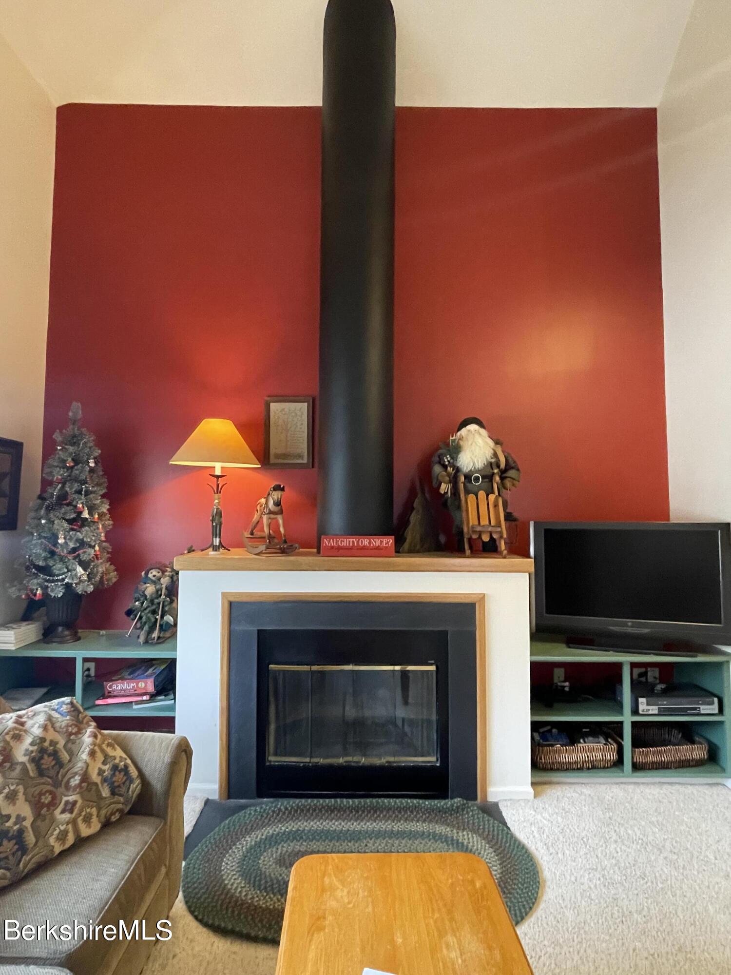 37 Corey Road, Unit 822 Hancock, MA 01237 - Photo 9 of 25 a living room with furniture and a fireplace