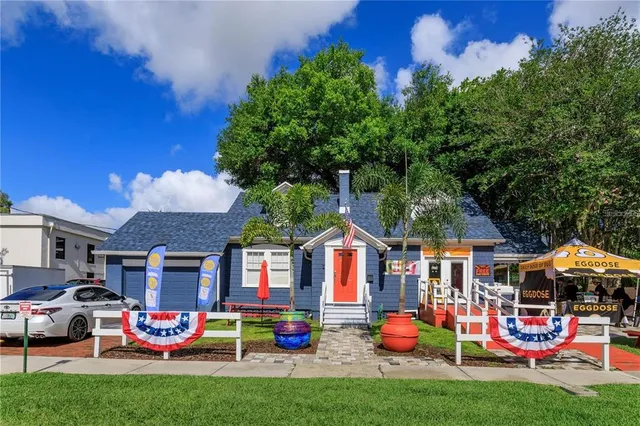a car parked in front of a brick house
