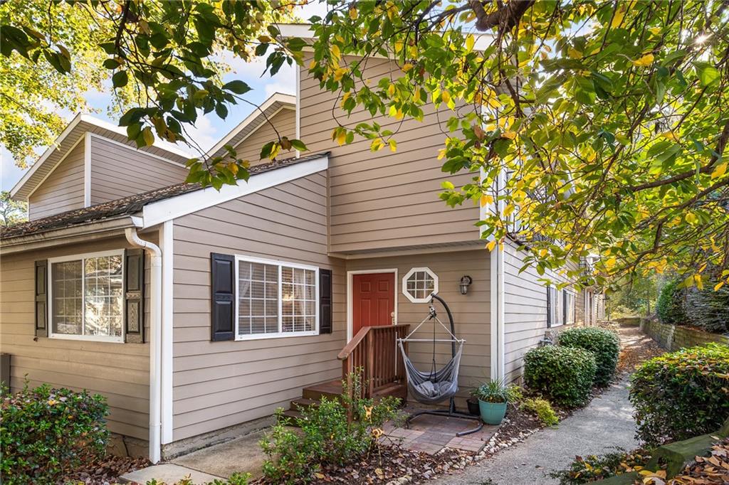 1468 Briarwood Road Northeast, Unit 1408 Atlanta, GA 30319 - Photo 1 of 1 a front view of a house with garden
