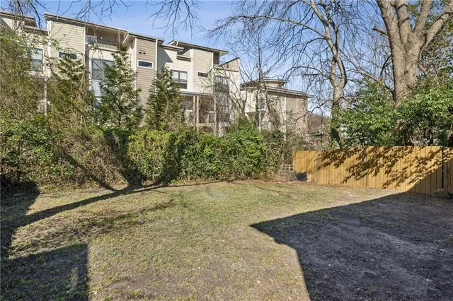 a view of a backyard of the house