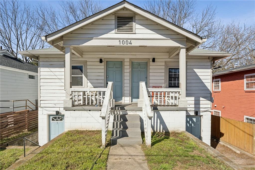 1004 Wylie Street Southeast, Unit 4 Atlanta, GA 30307 - Photo 2 of 19 a front view of a house with outdoor seating