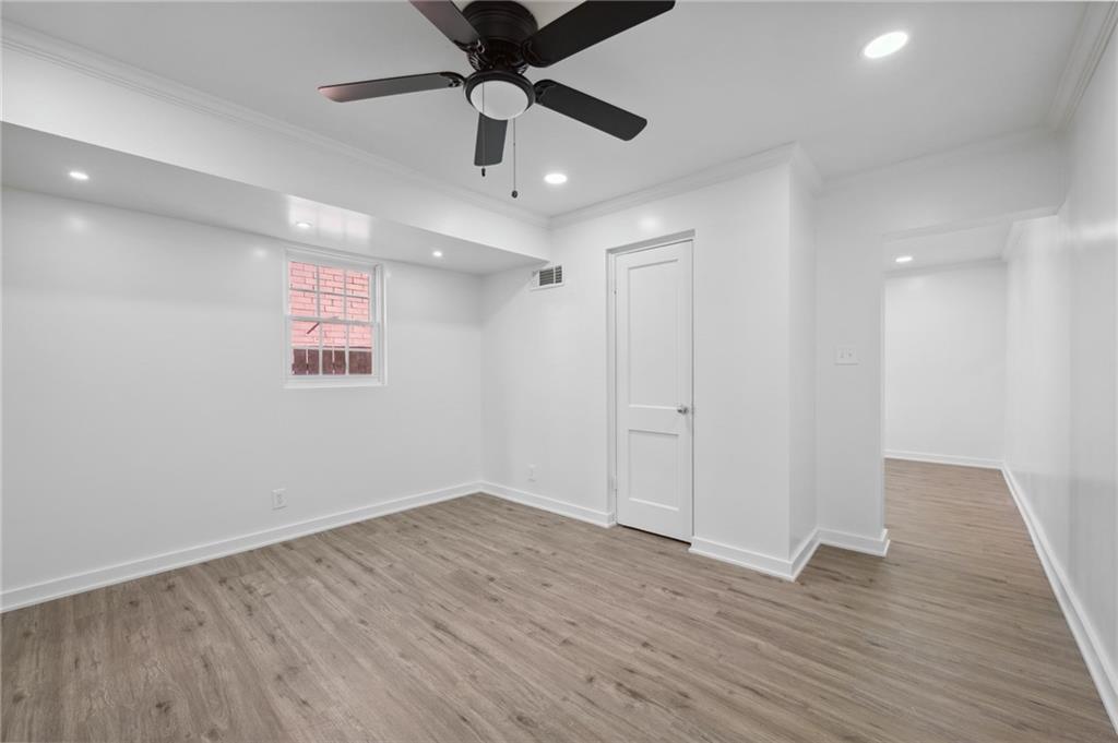 1004 Wylie Street Southeast, Unit 4 Atlanta, GA 30307 - Photo 8 of 19 wooden floor in an empty room with a window