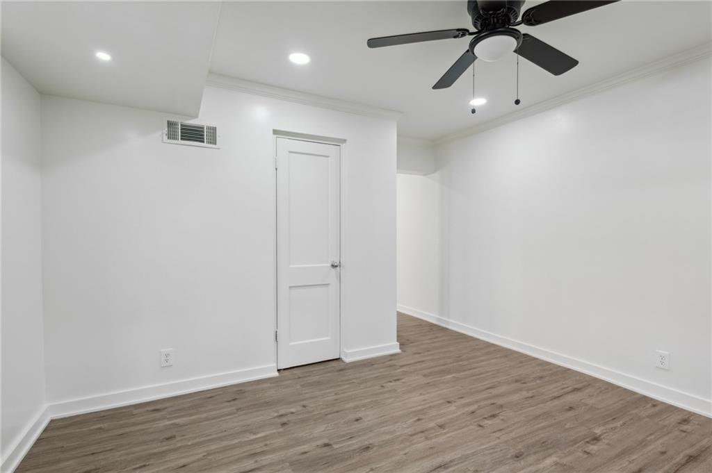 1004 Wylie Street Southeast, Unit 4 Atlanta, GA 30307 - Photo 9 of 19 wooden floor in an empty room