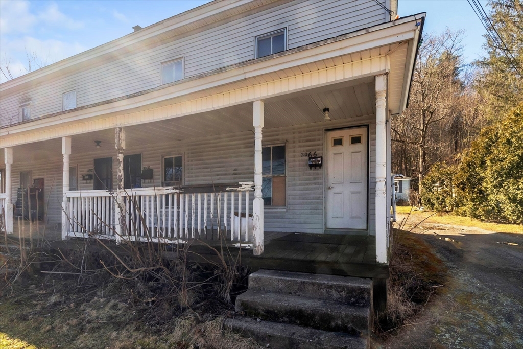 2066 Palmer Road Three Rivers, MA 01080 - Photo 15 of 17 a front view of a house with a yard