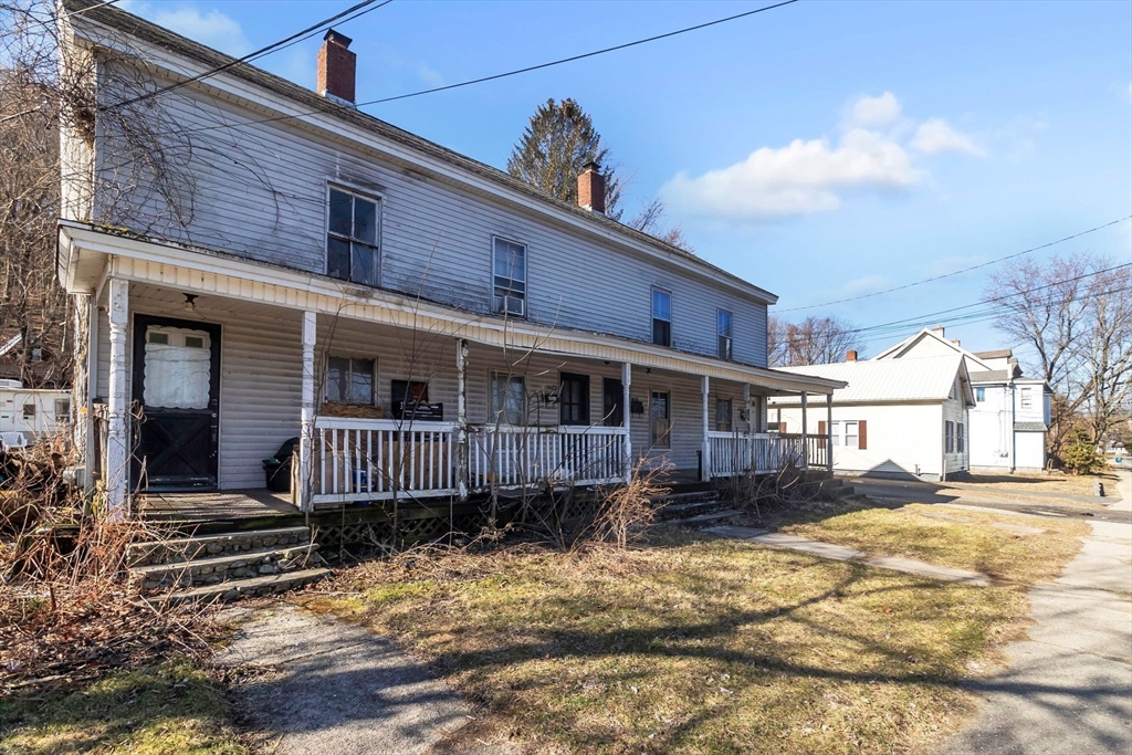 2066 Palmer Road Three Rivers, MA 01080 - Photo 17 of 17 a front view of a house with a yard