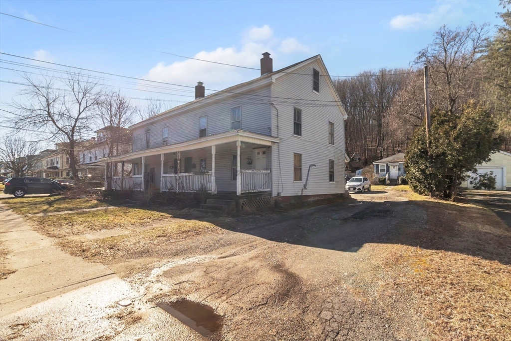 2066 Palmer Road Three Rivers, MA 01080 - Photo 3 of 17 a view of a house with snow on the road