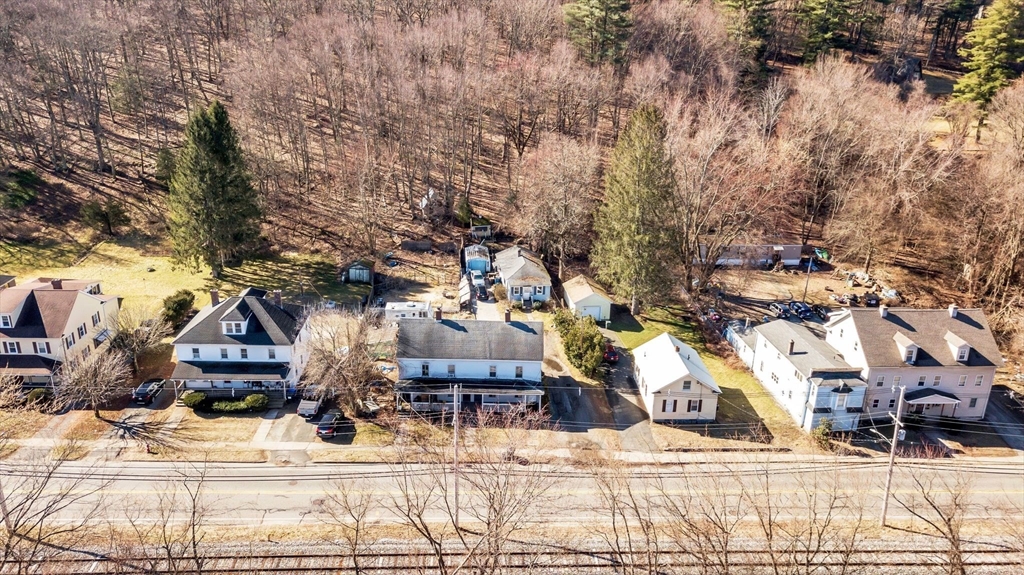 2066 Palmer Road Three Rivers, MA 01080 - Photo 8 of 17 a view of residential houses with wooden fence