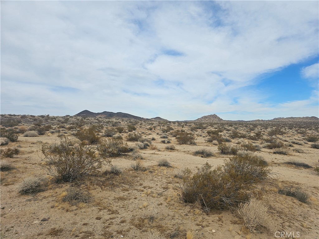 402 Rose Lane Lucerne Valley, CA 92356 - Photo 2 of 6 an aerial view of mountain with covered in the background