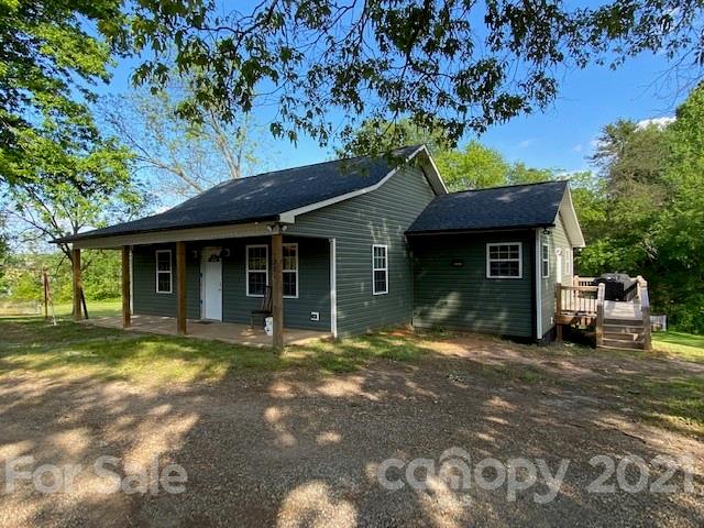 5281 Jenkins Road Morganton, NC 28655 - Photo 1 of 31 a front view of a house with a garden and trees
