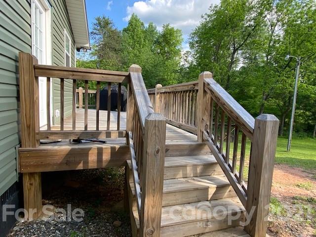 5281 Jenkins Road Morganton, NC 28655 - Photo 22 of 31 a view of balcony with wooden floor and outdoor seating