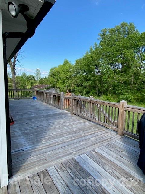 5281 Jenkins Road Morganton, NC 28655 - Photo 23 of 31 a view of deck with wooden floor and fence next to a yard