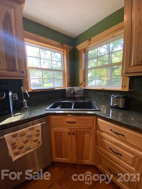 5281 Jenkins Road Morganton, NC 28655 - Photo 7 of 31 a kitchen with stainless steel appliances granite countertop a sink stove and window