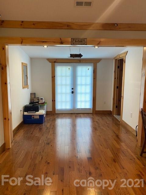 5281 Jenkins Road Morganton, NC 28655 - Photo 9 of 31 a hallway with wooden floor and cabinet