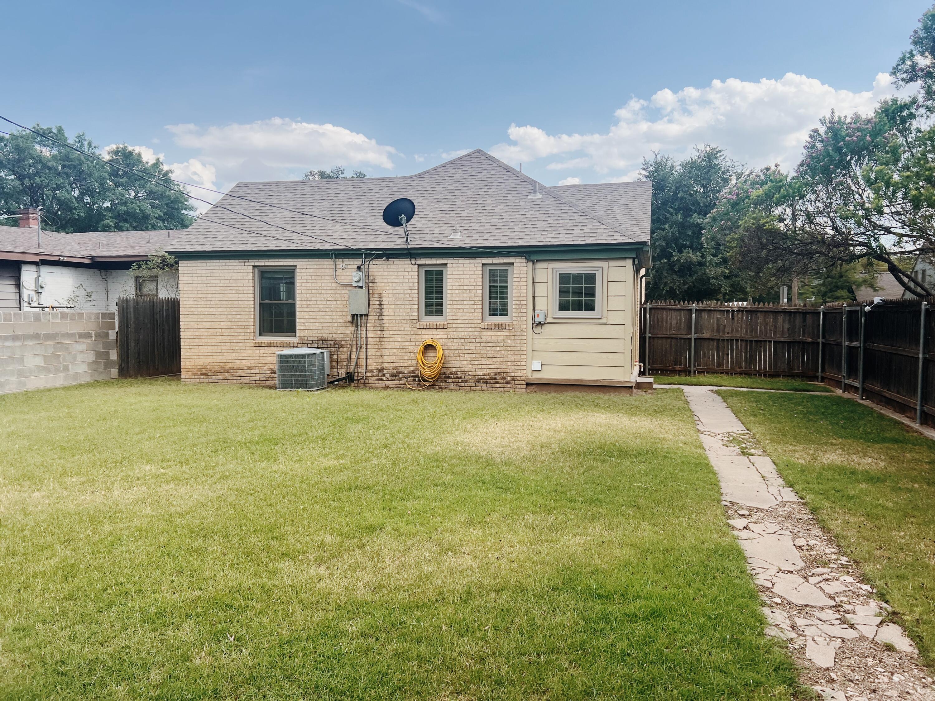 2916 21st Street Lubbock, TX 79410 - Photo 12 of 28 a front view of a house with patio