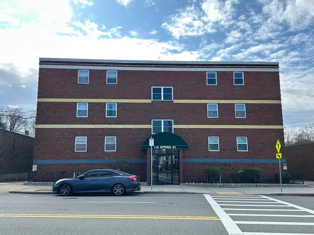 a car parked in front of a building