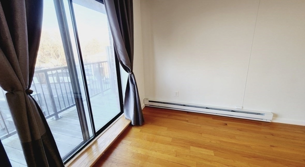 116 Spring Street, Unit D2 Boston, MA 02132 - Photo 4 of 9 a view of an empty room